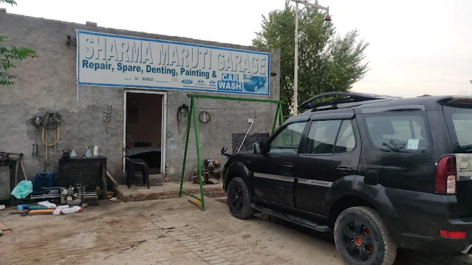 Sharma Maruti Garage workshop with a vehicle in for service